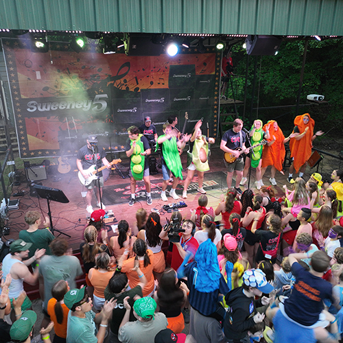 Campers rocking out at a Sweeney 5 concert