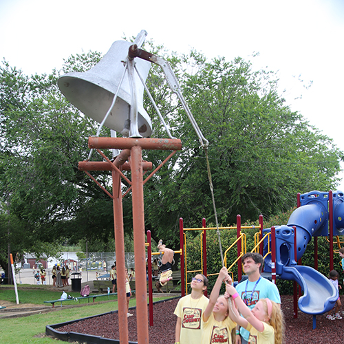 Campers ringing the ol' camp bell
