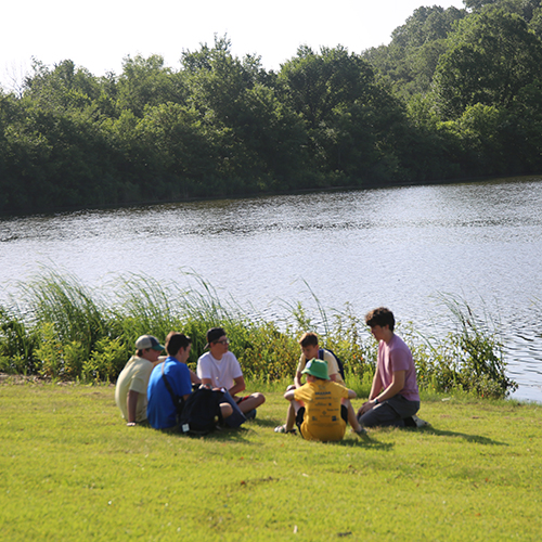 Campers beside lovely blue Lake Dealey
