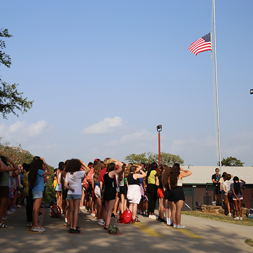 Campers and Staff paying tribute to the Flag