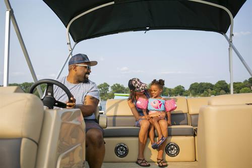 Family Riding on a Pontoon Boat