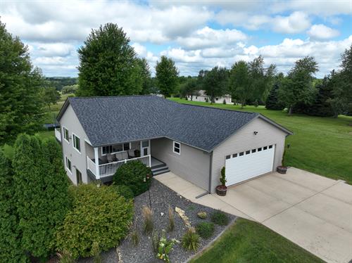 New Glarus home with freshly installed Moire Black roof. 