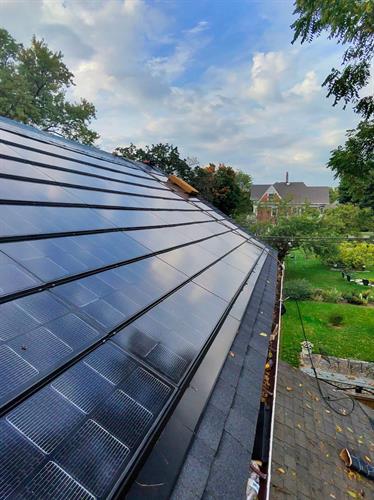 A close-up of our integrated solar shingle system bringing renewable power straight from the roof.