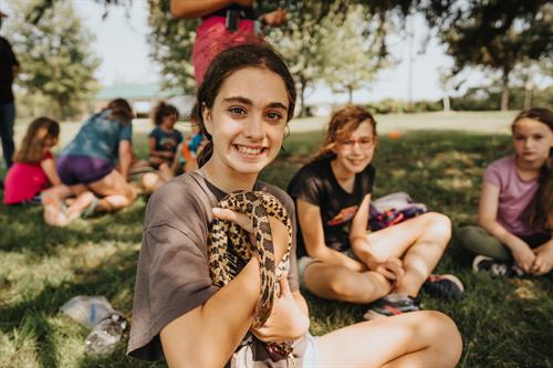 Summer campers meeting snakes up close at Shepard Farm.