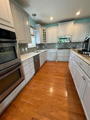 Kitchen cabinets, backsplash, counters, floors