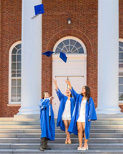 Graduates throwing their hats at UD in Newark Delaware