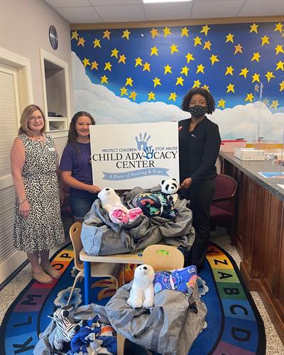 Donation from Hannah Ross of Village Christian Academy for 5 handmade blankets with stuffed animals and duffel bags for the children at the CAC. 