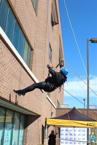 United Way Donors rappelling 50 feet down to raise funds for United Way