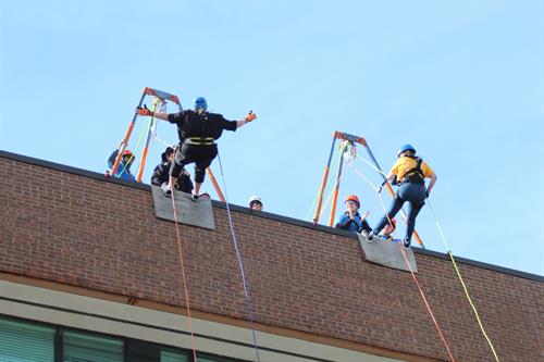 United Way Donors rappelling 50 feet down to raise funds for United Way