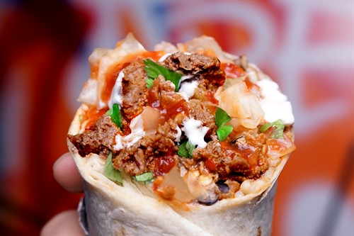 Seared and spicy Carne Asada Burrito, get it with either pico or kim chi!