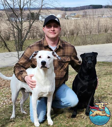 Christian, founder of Scoop, Scoop, and Away, with his loyal companions on the job. Christian, founder of Scoop, Scoop, and Away, with his loyal companions on the job.