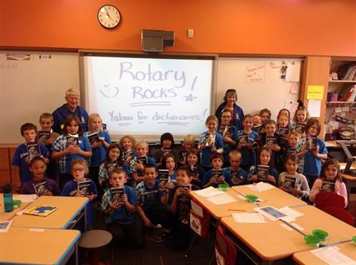 Lander Rotary distributes dictionaries to local third graders