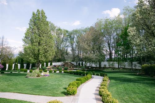 Large backyard gardens with large waterfall