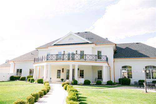 Rear image of the building showing the large balcony and patio