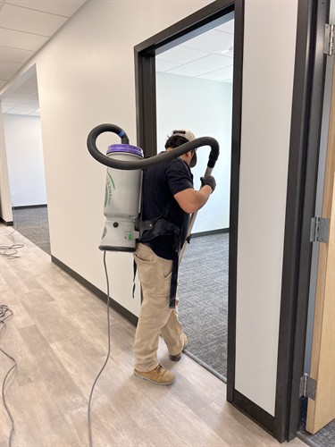 Jani-Serv, Inc. Staff vaccuuming dust from construction for building in Salt Lake City