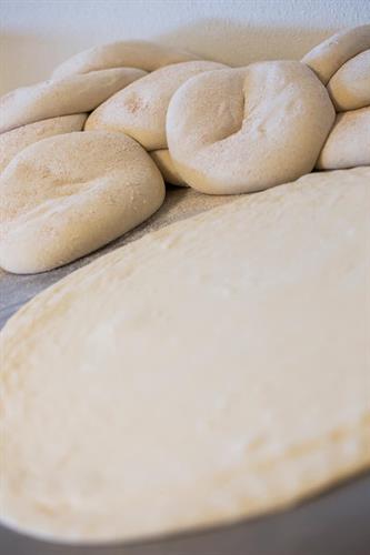 Dough made fresh daily. Hand-tossed dough made to order - thick, thin or regular.