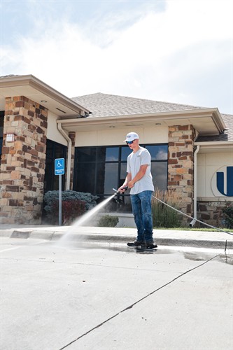Pressure Washing before striping at Western State Bank.