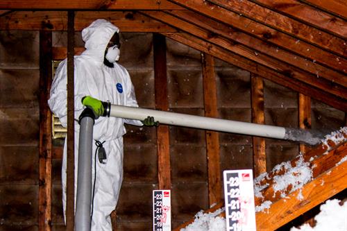 Insullation is added to the attic of a LaGrange home as part of the Save On Utilities Long term program