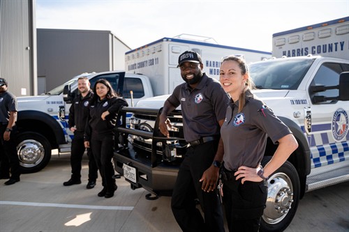Gallery Image Medic_team_smiling_with_trucks_(1).jpg