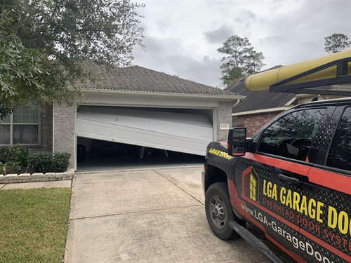 Gallery Image garage_door_off_track_repair.jpg Gallery Image garage_door_off_track_repair.jpg