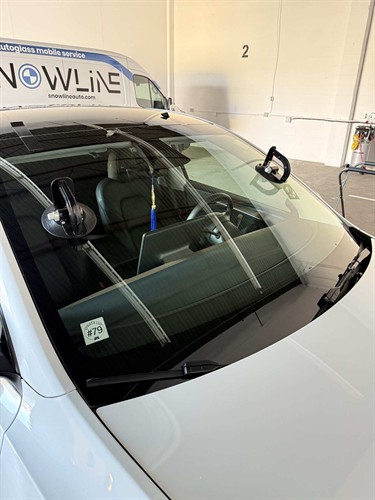 Certified technician performing a windshield replacement at Snowline Autoglass in Langley, BC.