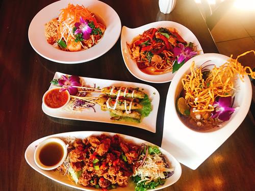 Hero shot of some of the delicious dishes at Ban Chok Dee Thai Cuisine