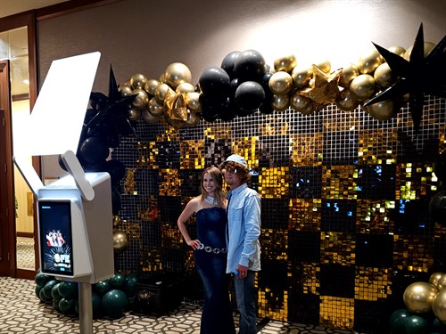 Diamond Photo Booth with black and gold balloon wall