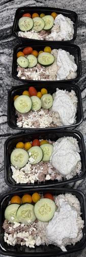 greek bowl with ground turkey and rice, tomatoes, cucumber and feta and homemade tzatziki sauce