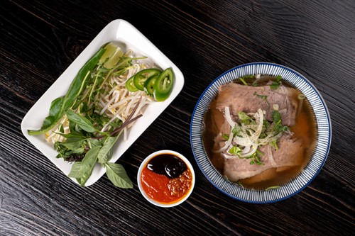 Pho with Briskets - bone broth, rice noodles, and wagyu briskets (Halal) serve with bean sprouts and herbs.
