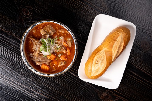 Wagyu Beef Stew - Brisekts, carrots, Annatto seed for coloring serve with either bread, noodles or rice.