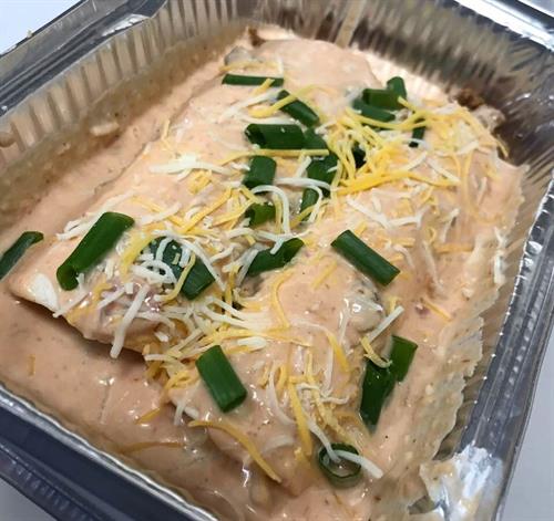 Ground beef enchiladas with Wixom Farm ground beef and Muranda Cheese queso