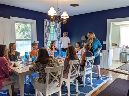 Gallery Image chef_somm_laura_serving_with_scott_bright_blue_room.jpg