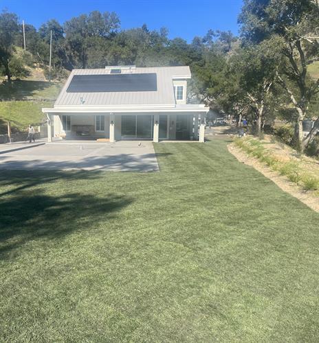 New sod and re-built home after previously destroyed by fire