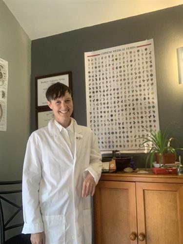 Dr. Kade Stotler DACM, LAc (They/Them) Near Fountain and Herbal Medicine Cabinet