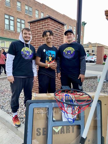 Players Graylin Seeley & AJ Thomas with raffle winner (brand new basketball goal) at this years first Broad Street Cruise In 