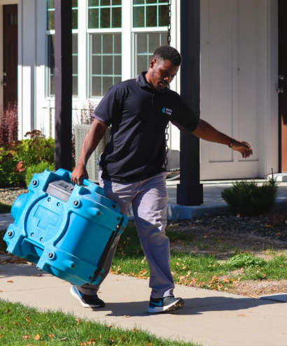 Technician delivering high-capacity drying equipment for water damage cleanup. Fast local response 24/7 Technician delivering high-capacity drying equipment for water damage cleanup. Fast local response 24/7