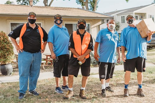 Squadron Members supporting the community by distributing food and supplies during COVID 19 