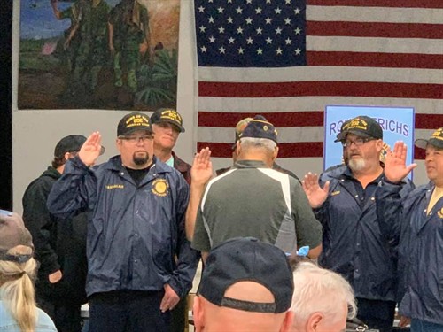 Commander Mike Clement Officiating the swearing in ceremony
