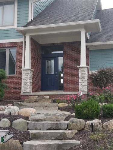 Stacked Stone, Custom Porch Posts, Designed Steps.