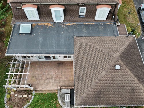 Installed a VELUX curb mounted skylight with solar blinds, installed all new EPDM roofing with a new entry door & storm door, then installed new shingles in Carlisle, PA