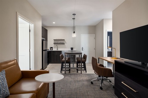 Modern two-bedroom suite featuring private bedrooms, full kitchen, and a roomy living space