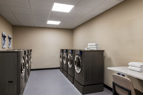 Onsite laundry facilities available for long-term guests and project teams