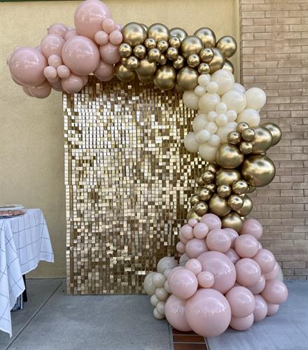 Champagne shimmer wall rental + 12 foot balloon garland 