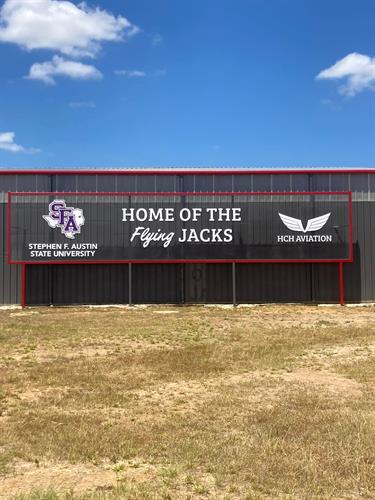 Formed Plastic letters on expanded metal backer panel with posts.