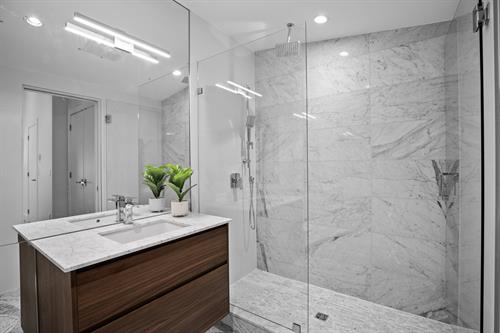 Shower waterproofing and tiling, Natural stone, Vanity, glass door and lighting