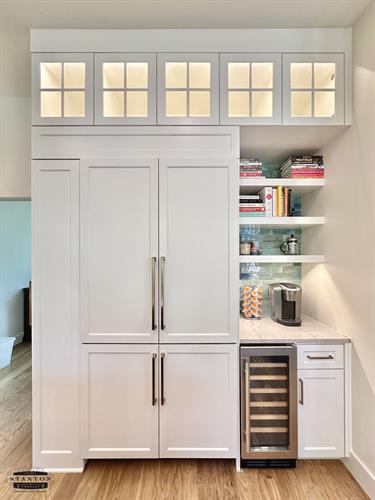 Refrigerator with panel doors to match cabinets along with coffee station and wine chiller