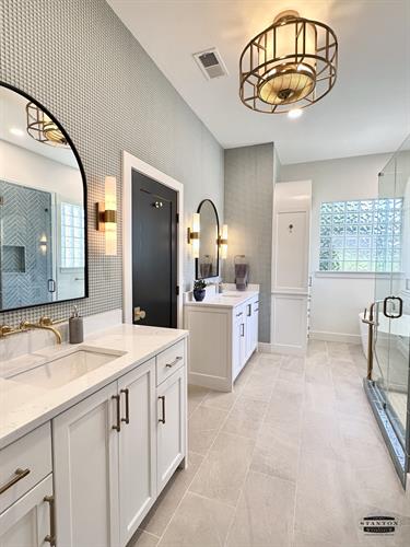 Primary bathroom remodel with new cabinets, countertop, shower, and tub.