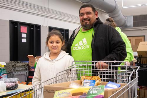 A family at The Big Idea at Frances Slocum, where every month we provide a space for low-income students and their families to get food and network with teachers and other school staff to promote parental engagement with their students' learning. 