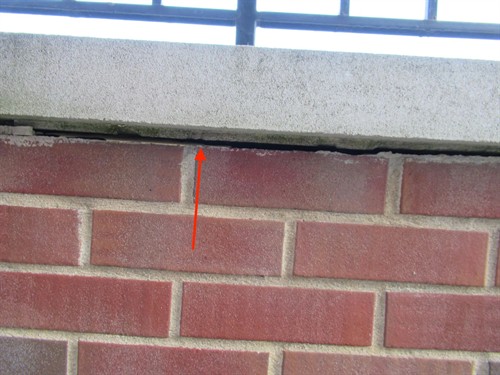 Masonry Consulting - no flashing under capstones