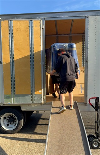 Cypress movers loading sofa into the truck